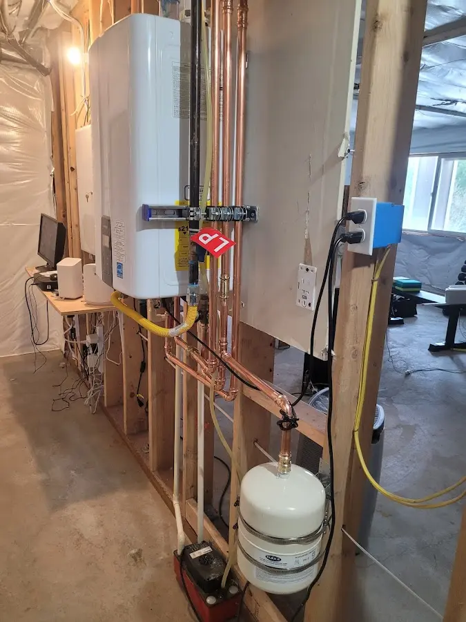 Licensed plumber repairing a kitchen sink in Baxter